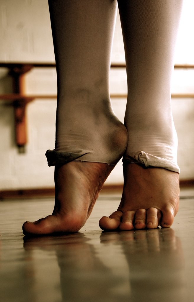 Ballet feet Ballet dancer on releve in cutoff tights
